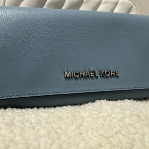 Big blue Michael Kors wallet.